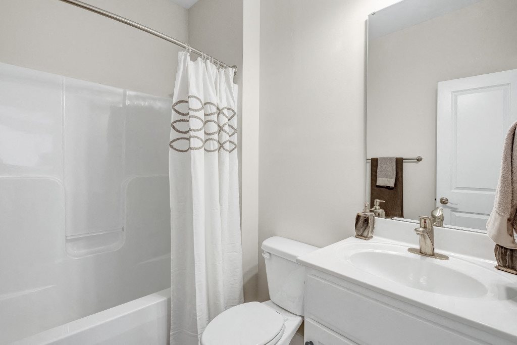 Pet-Friendly Apartments in Wilmington, NC - Myrtle Landing Bathroom with Single Sink Vanity and Garden Shower Tub